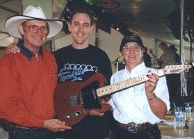 Allan and Barbara Tomkins with the winner of the Tamworth Band contest Rob Black